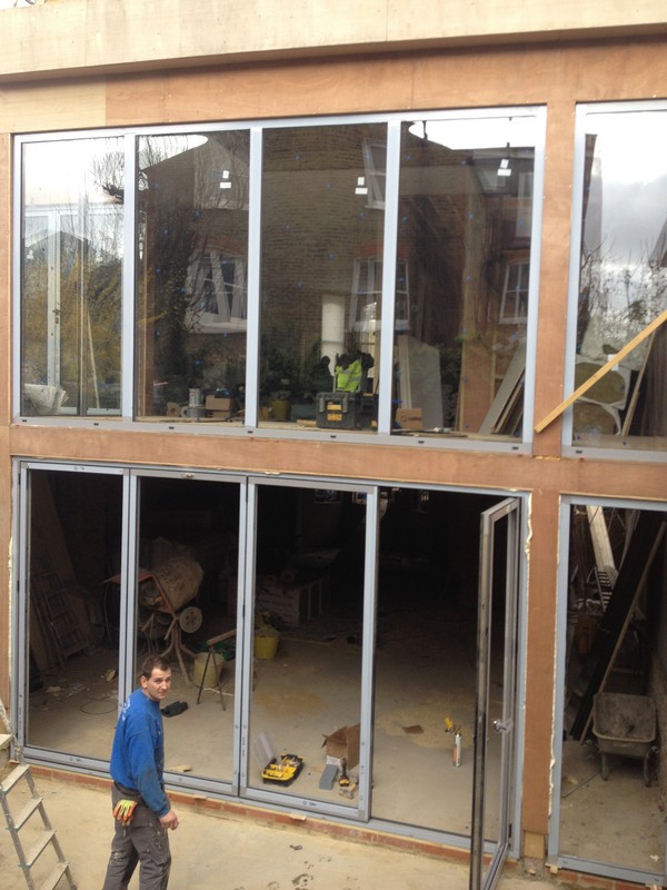 Aluminium bi-fold doors with two-storey glazing in London