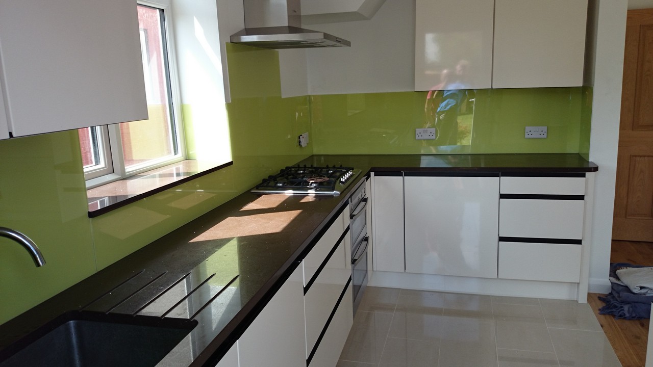 Lime green glass kitchen splashback installed by London glaziers