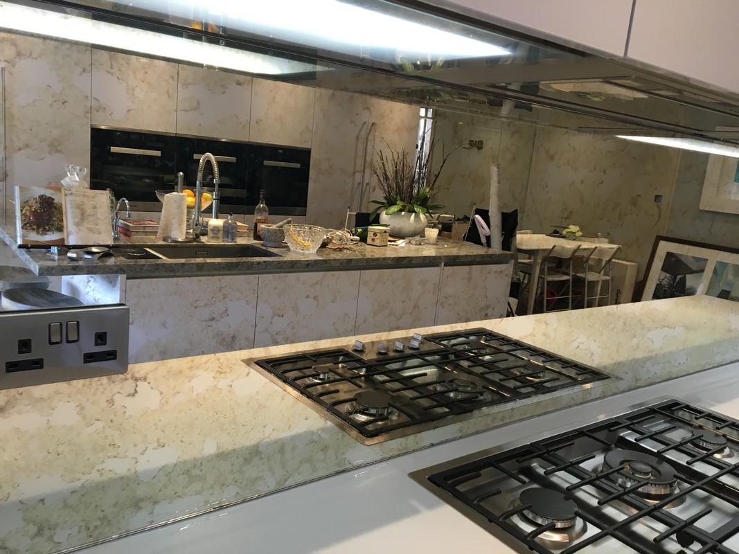 Mirror glass splashback in London luxury kitchen
